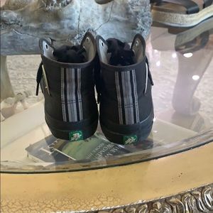 PF Flyers black with gray stripes on back.